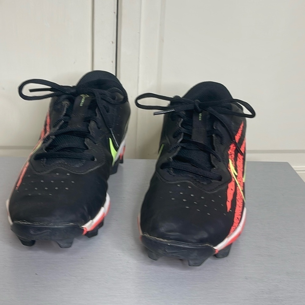 Nike Kids Black Cleats with Neon Yellow Swoosh and Red Accents